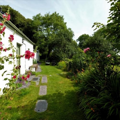 Boltholes and Hideaways Ty Llan Side of house into garden 1621