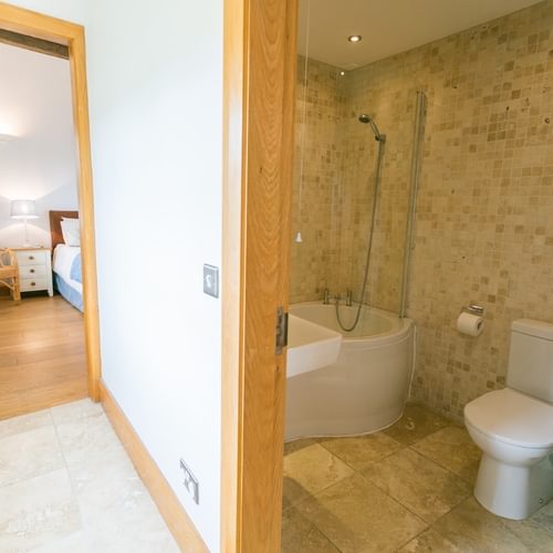 Botholes and Hideaways The Dairy Borthwen Barns Anglesey Master bedroom and family bathroom