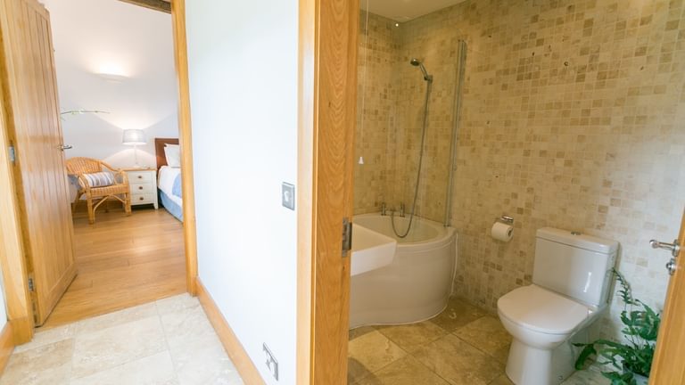 Botholes and Hideaways The Dairy Borthwen Barns Anglesey Master bedroom and family bathroom