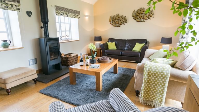 Botholes and Hideaways The Dairy Borthwen Barns Anglesey sitting room from kitchen
