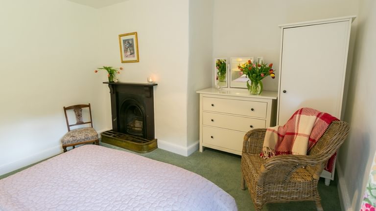 Boltholes and Hideaways Anglesey Plas Lligwy double bed to fire