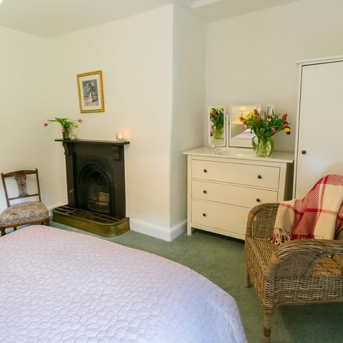 Boltholes and Hideaways Anglesey Plas Lligwy double bed to fire