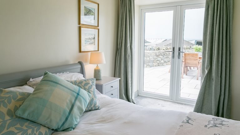 Boltholes and Hideaways Bettws Farmhouse Cemaes Bay bedroom 1 to terrace
