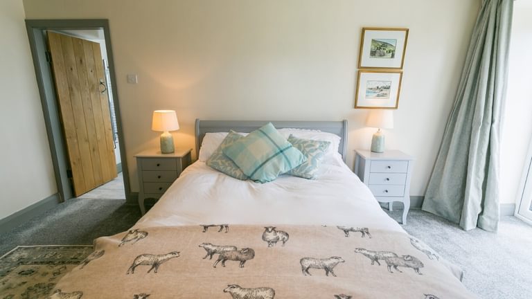 Boltholes and Hideaways Bettws Farmhouse Cemaes Bay bedroom 1 to bed
