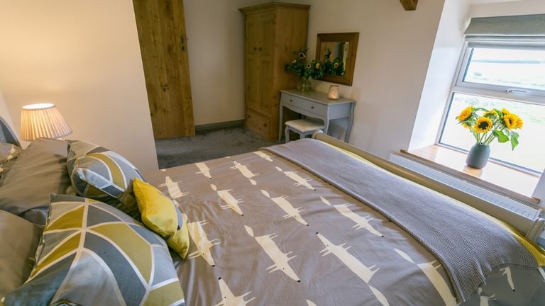 Boltholes and Hideaways Bettws Farmhouse Cemaes Bay bedroom 2 to window