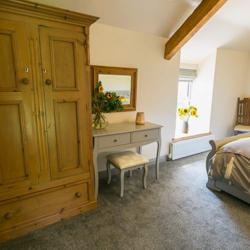 Boltholes and Hideaways Bettws Farmhouse Cemaes Bay bedroom 2 to bed