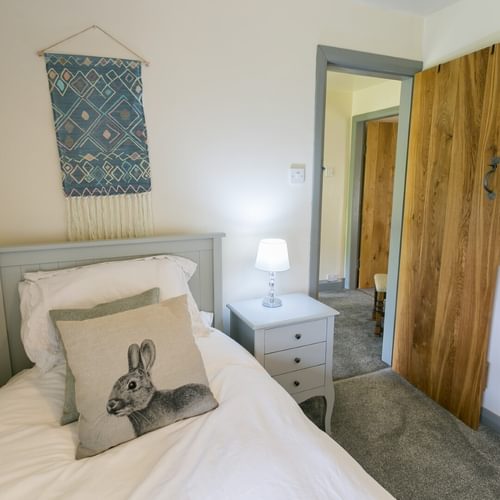 Boltholes and Hideaways Bettws Farmhouse Cemaes Bay bedroom to landing