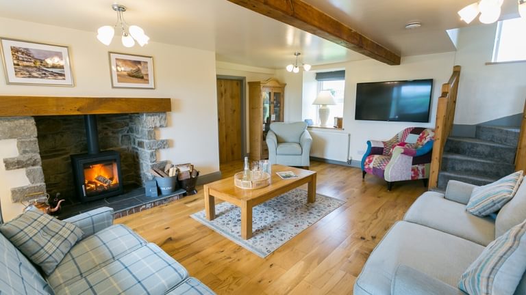 Boltholes and Hideaways Bettws Farmhouse Cemaes Bay sitting room to stairs