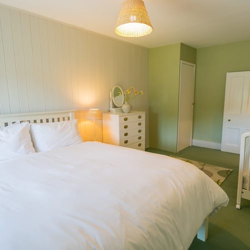 Boltholes and Hideaways Bears Cottage Lligwy king size bed to door