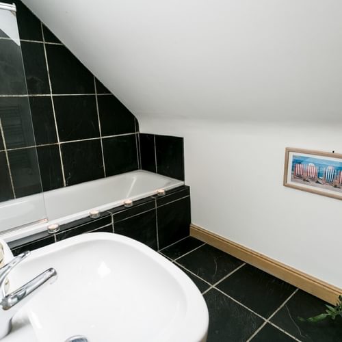 Boltholes and Hideaways Bwthyn Bach Church Bay bath and shower over