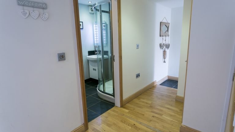 Boltholes and Hideaways Bwthyn Bach Church Bay downstairs family shower room
