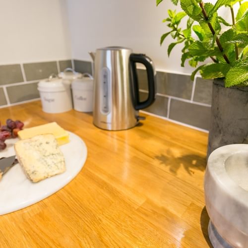 Boltholes and Hideaways Glan Y Mor Beaumaris sleeps 4 dog friendly kitchen cheese