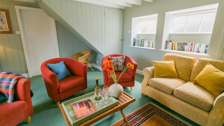 Boltholes and Hideaways Fancy House Lligwy Anglesey sitting room chairs