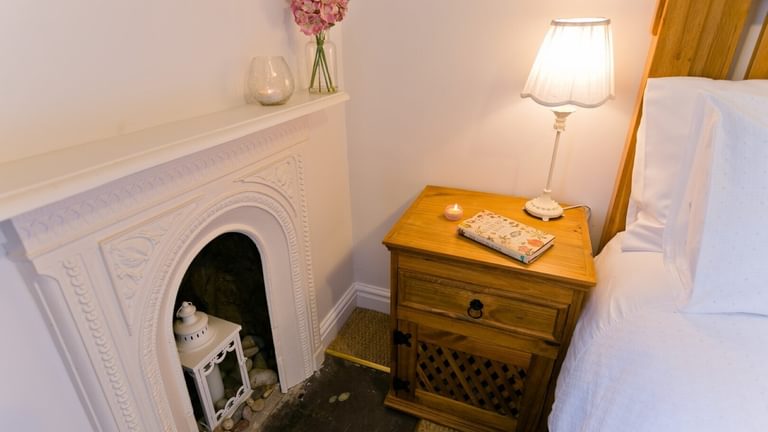 Boltholes and Hideaways Honey Hill Cottage Llangoed double bedroom fireplace