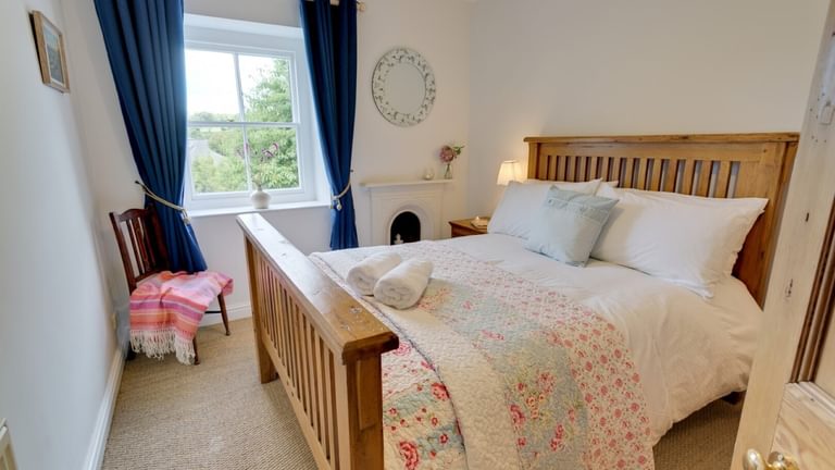 Boltholes and Hideaways Honey Hill Cottage Llangoed double bedroom garden side