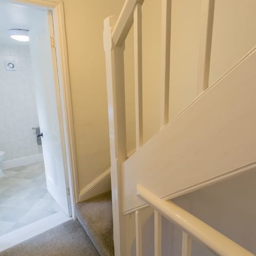 Boltholes and Hideaways Heulfre Beaumaris sleeps 4 stairs to top floor bedroom 1620