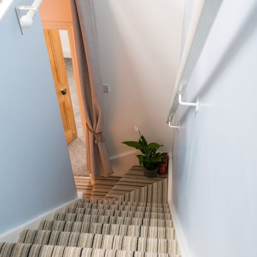 Boltholes and Hideaways Hyfrydle Beaumaris stairs to double bedroom 1080