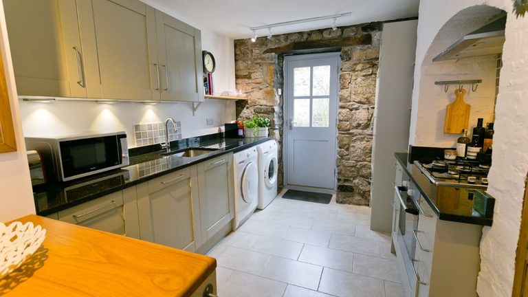 Boltholes and Hideaways Melvin Cottage Beaumaris kitchen to courtyard 1620