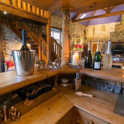 Boltholes and Hideaways Tal Y Bont Stables bar to hall open fire 1649