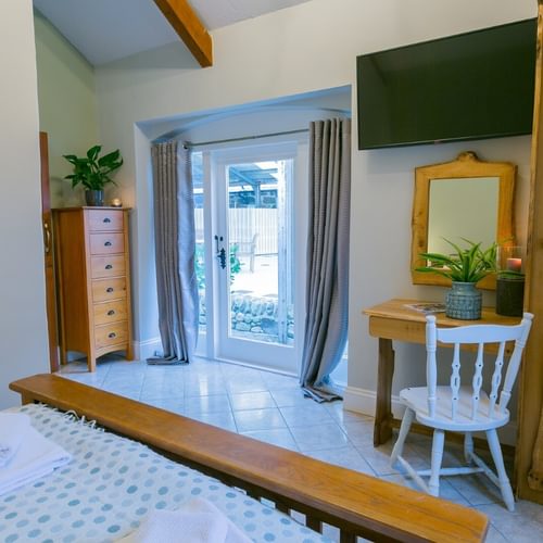 Boltholes and Hideaways Tal Y Bont Uchaf Stables Merlin Suite king bed to entrance 1620