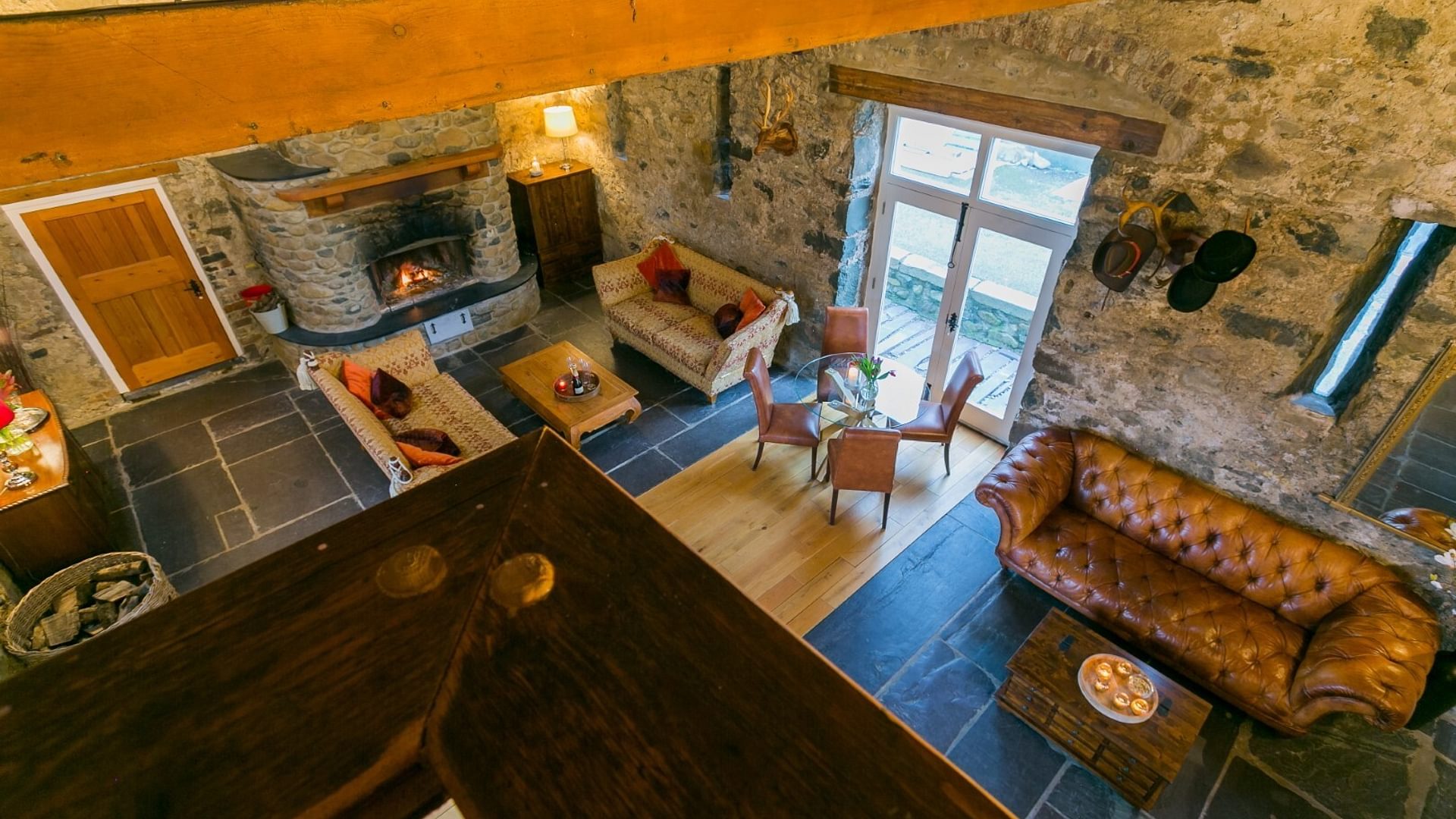 Boltholes and Hideaways Tal Y Bont Uchaf Stables hall from stairs 1620