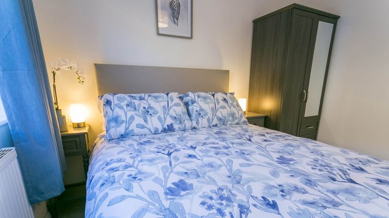Bron Heulog Llanerchymedd Anglesey bedroom blue 1920x1080