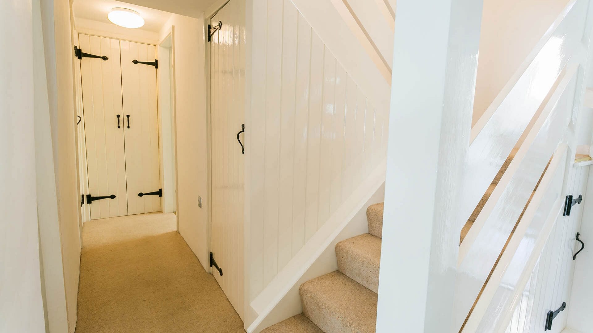 Gower Cottage Beaumaris Anglesey hallway stairs 2 1920x1080