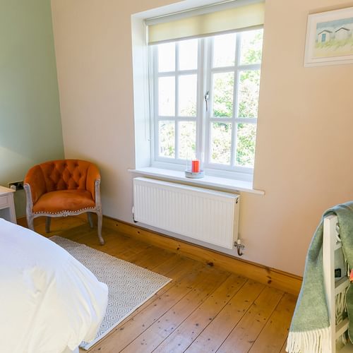 Glan Gors Felin Church Bay Anglesey king bedroom orange 3 1920x1080