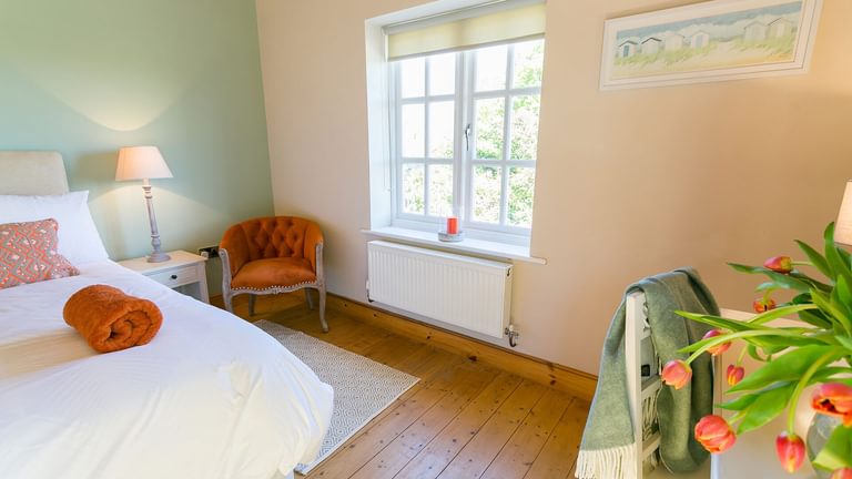 Glan Gors Felin Church Bay Anglesey king bedroom orange 3 1920x1080