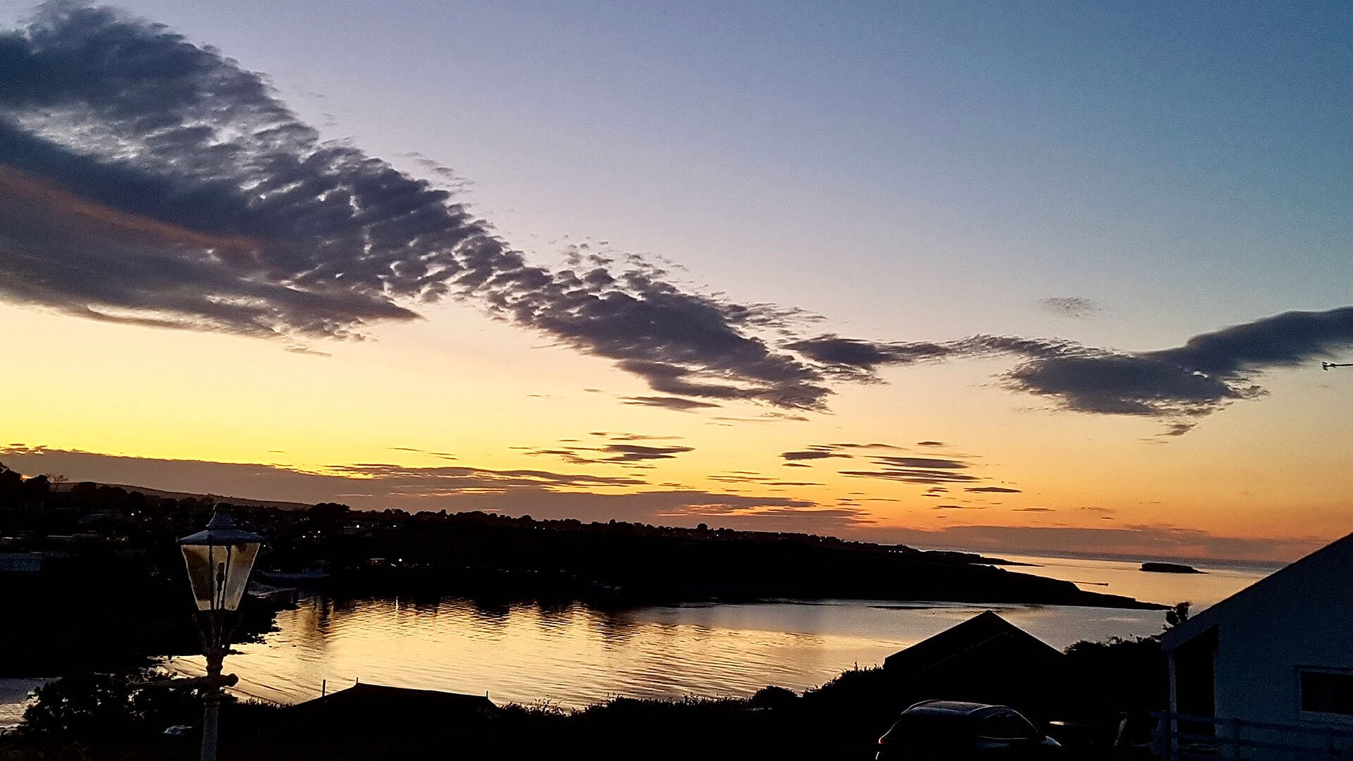 Dinas Cottage Benlleach Anglesey sunset over tview of traeth bychan 1920x1080