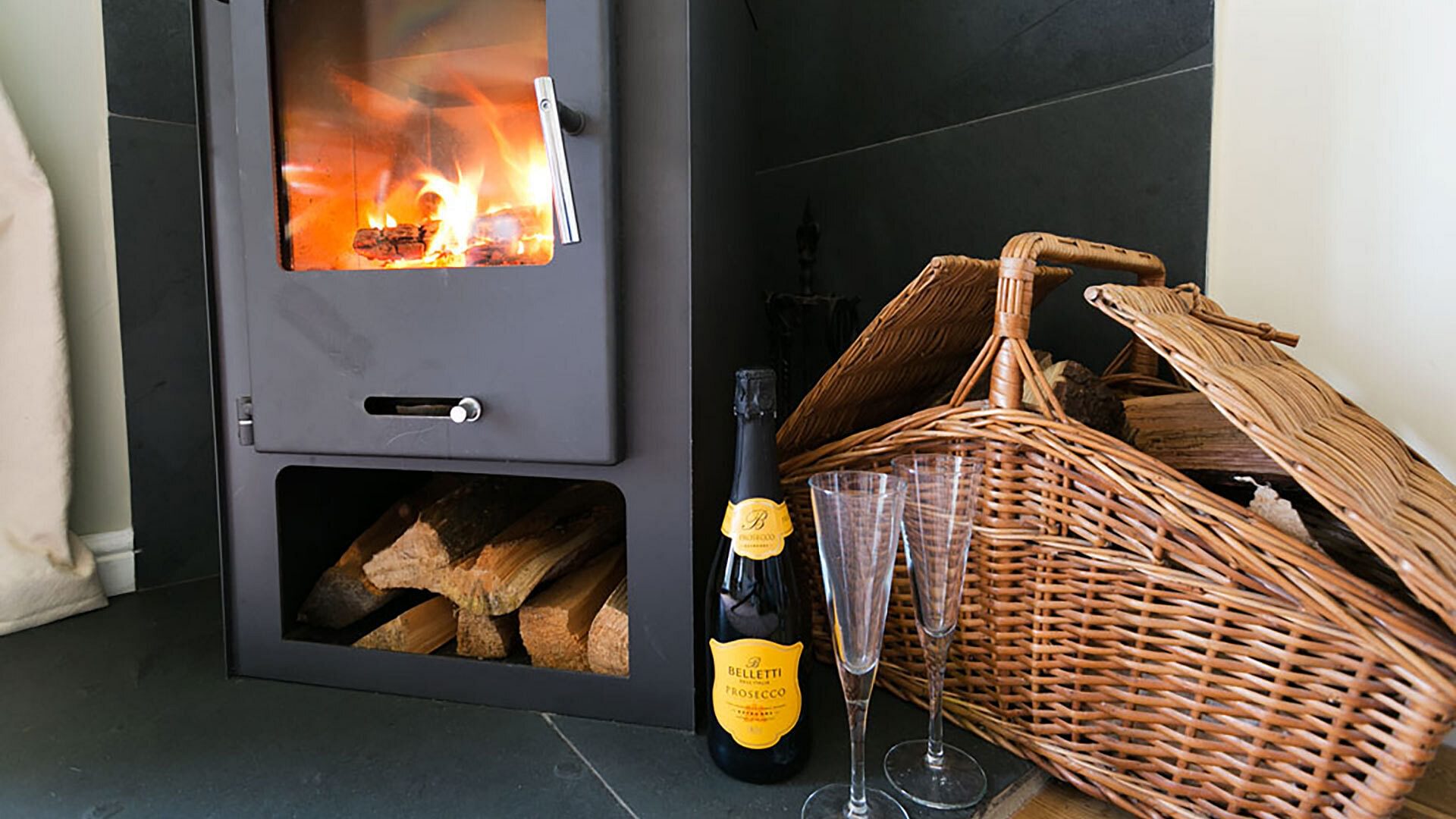 Duck House Bodorgan Anglesey champagne in front of fire 1920x1080