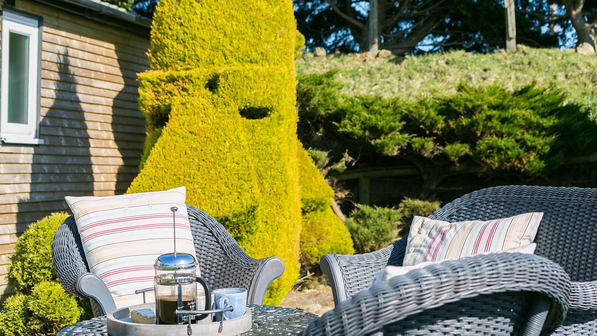 Easter Cabin Lligwy Anglesey garden seating topiary 2 1920x1080