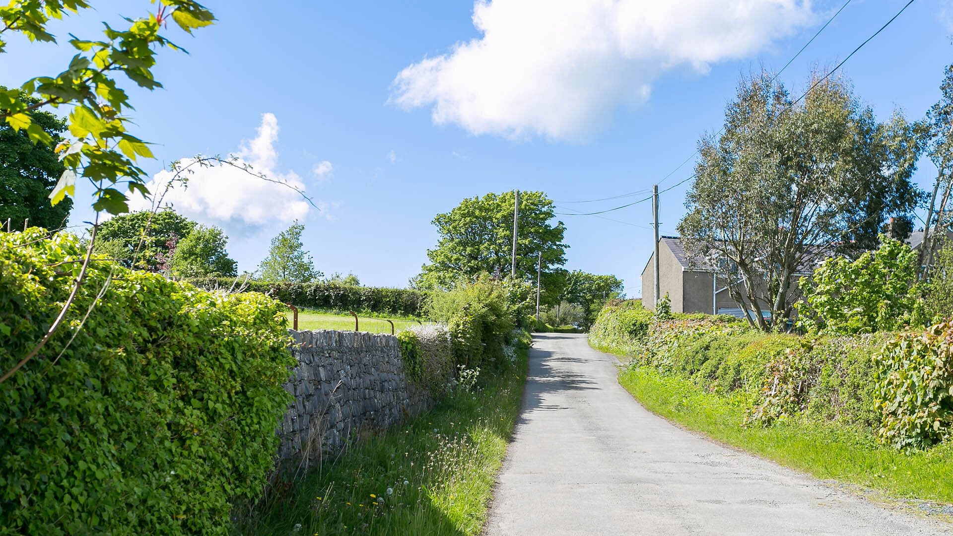 Pant Y Afallen Benllech Anglesey country lane 2 1920x1080