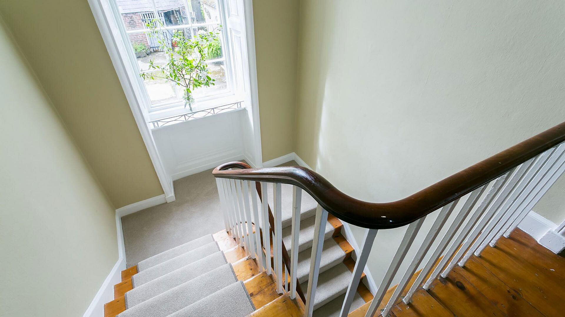 Plas Cichle Beaumaris Anglesey stairs down from top floor 1920x1080