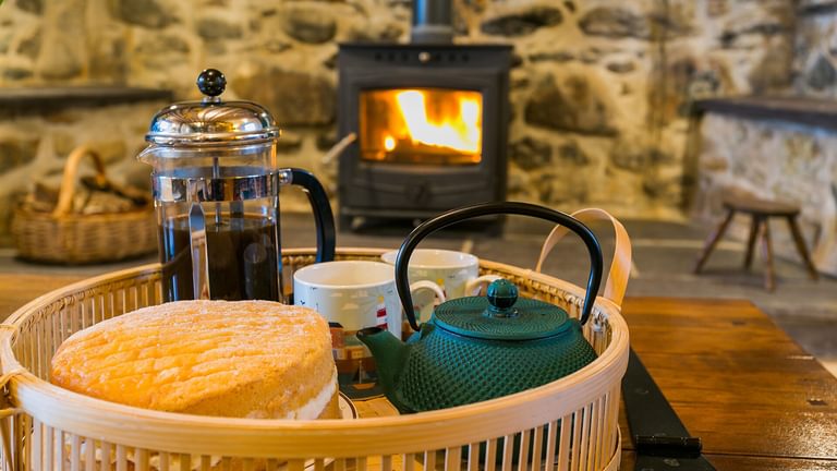 Tal Y Bont Farmhouse Bangor Gwynedd sitting room tea by the log burner 1920x1080